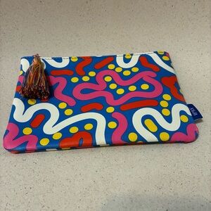 Small colorful Ipsy bag